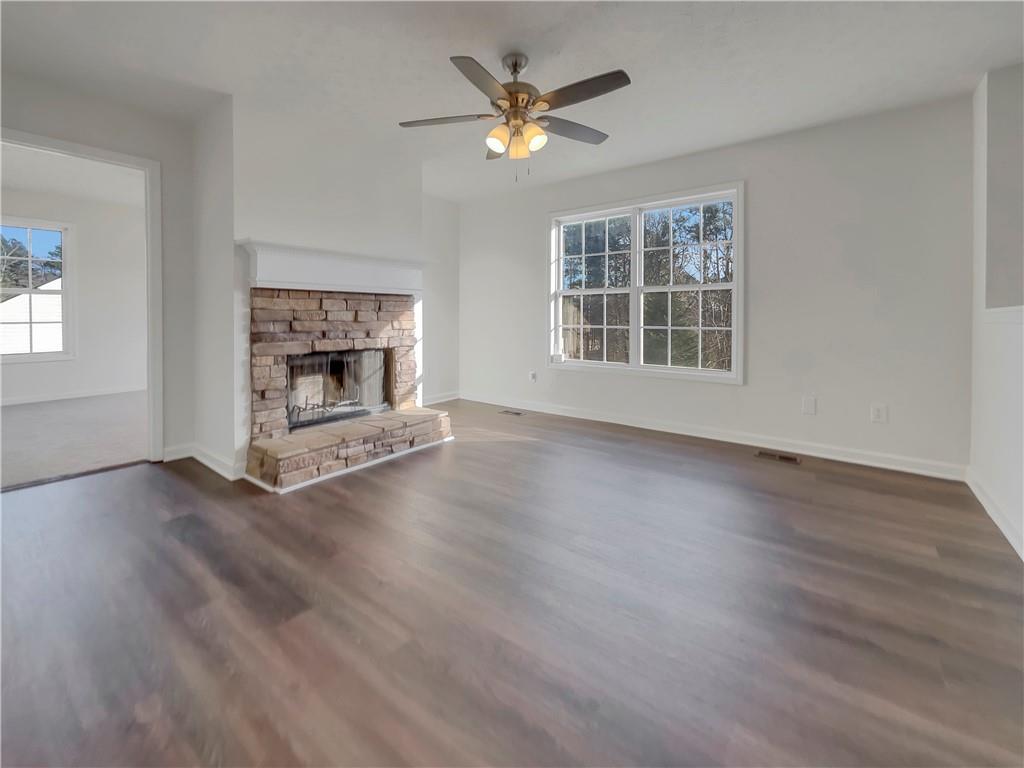 35 Grove Lane Temple, GA 30179 - Photo 7 of 25 a view of wooden floor fire place and windows in an empty room
