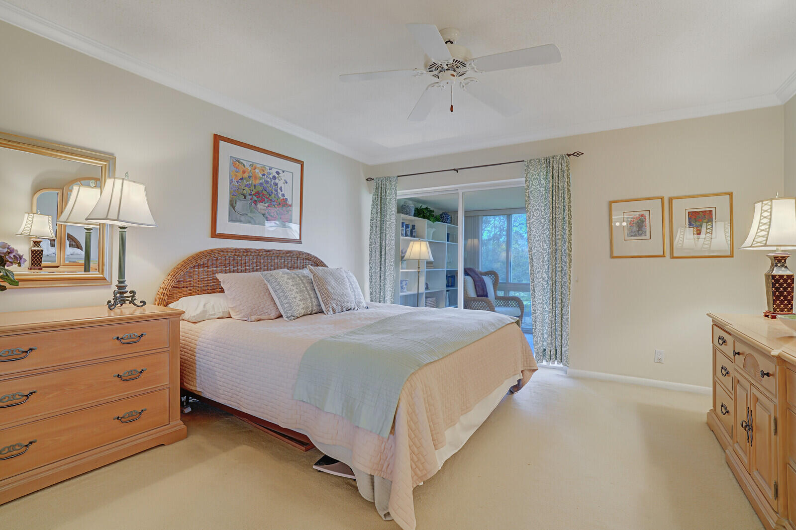 20 Celestial Way, Unit 314 Juno Beach, FL 33408 - Photo 16 of 35 a bedroom with a large bed and a chandelier
