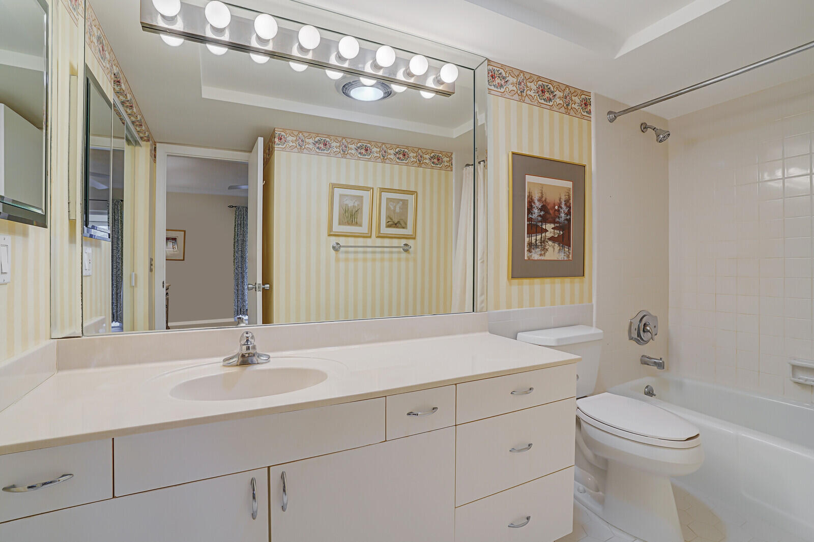 20 Celestial Way, Unit 314 Juno Beach, FL 33408 - Photo 18 of 35 a bathroom with a sink a toilet and shower