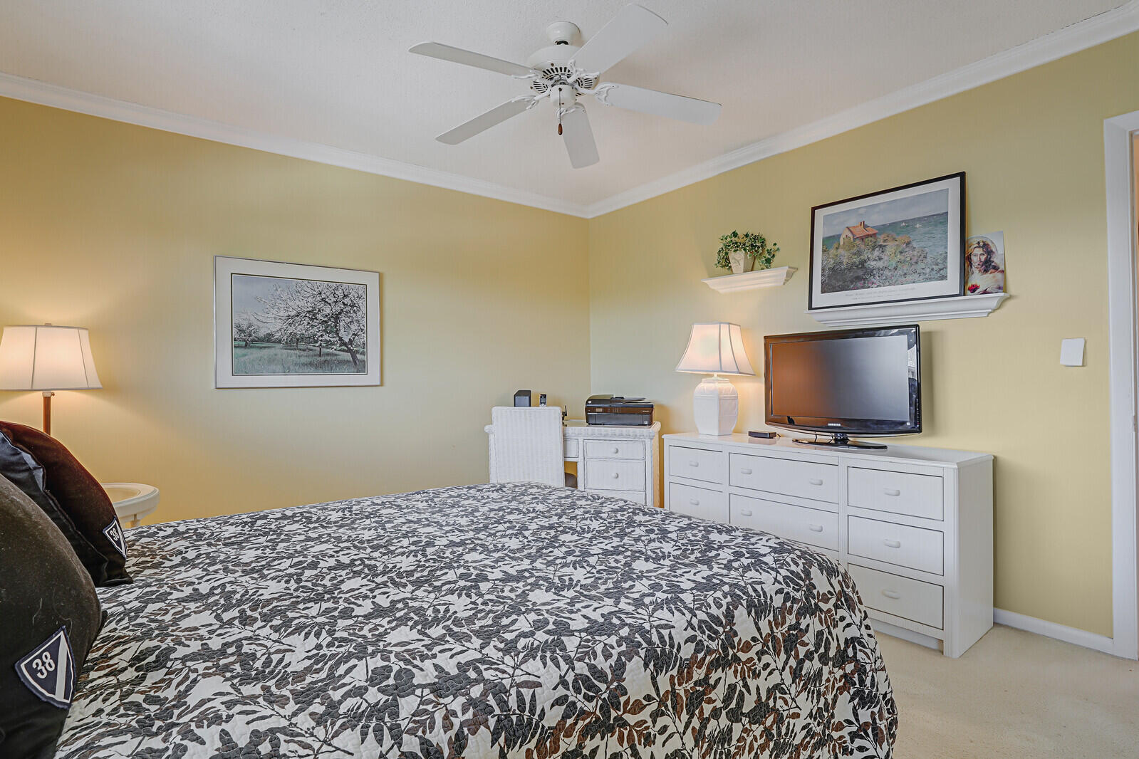 20 Celestial Way, Unit 314 Juno Beach, FL 33408 - Photo 20 of 35 a bedroom with a bed and a flat screen tv