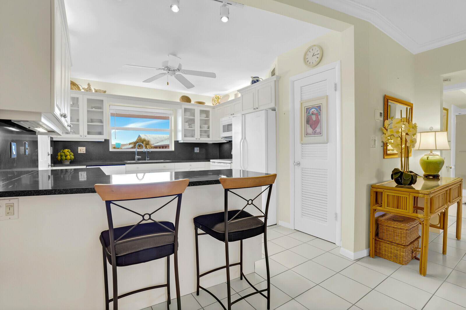 20 Celestial Way, Unit 314 Juno Beach, FL 33408 - Photo 5 of 35 a kitchen with stainless steel appliances kitchen island granite countertop a refrigerator and a stove top oven