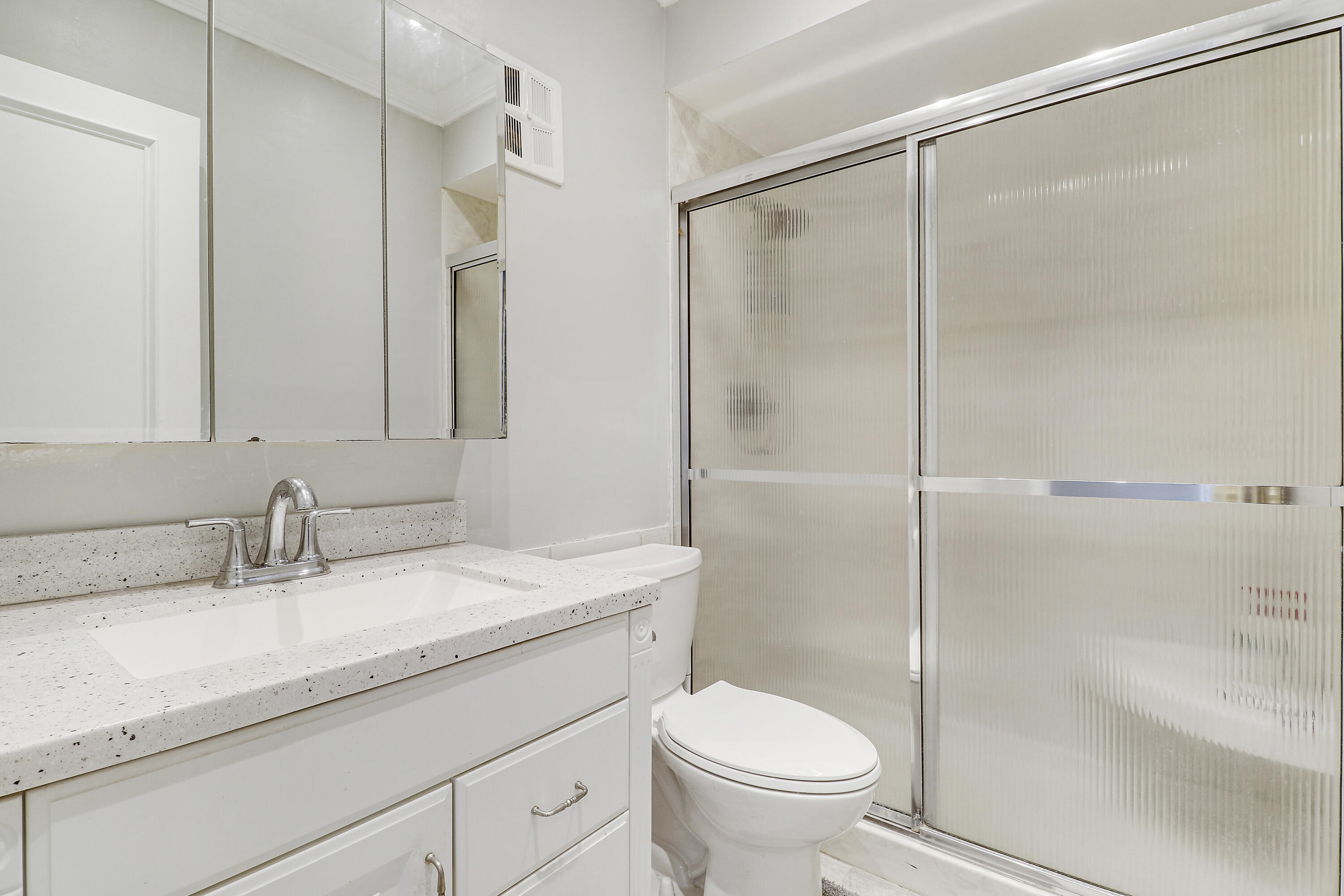 2600 South Kanner Highway, Unit Q8 Stuart, FL 34994 - Photo 20 of 52 a bathroom with a granite countertop sink toilet and shower
