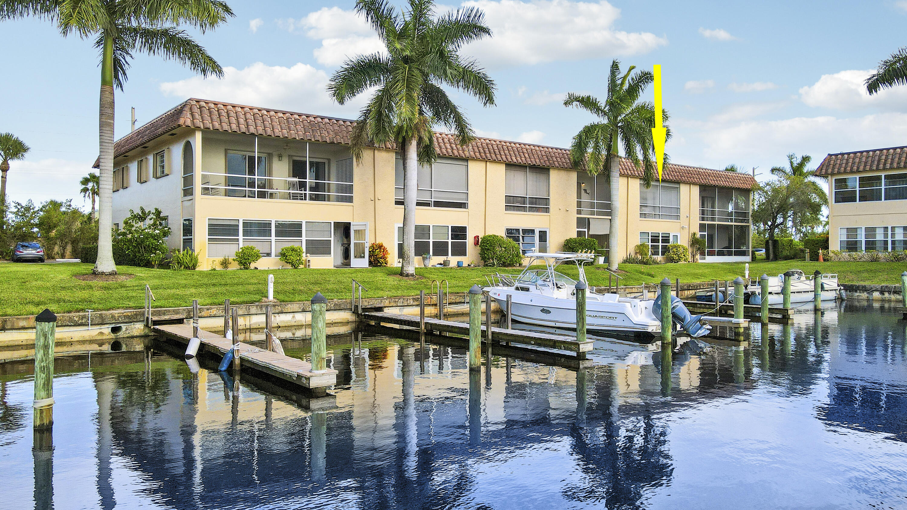 2600 South Kanner Highway, Unit Q8 Stuart, FL 34994 - Photo 2 of 52 a view of a building with garden and sitting area