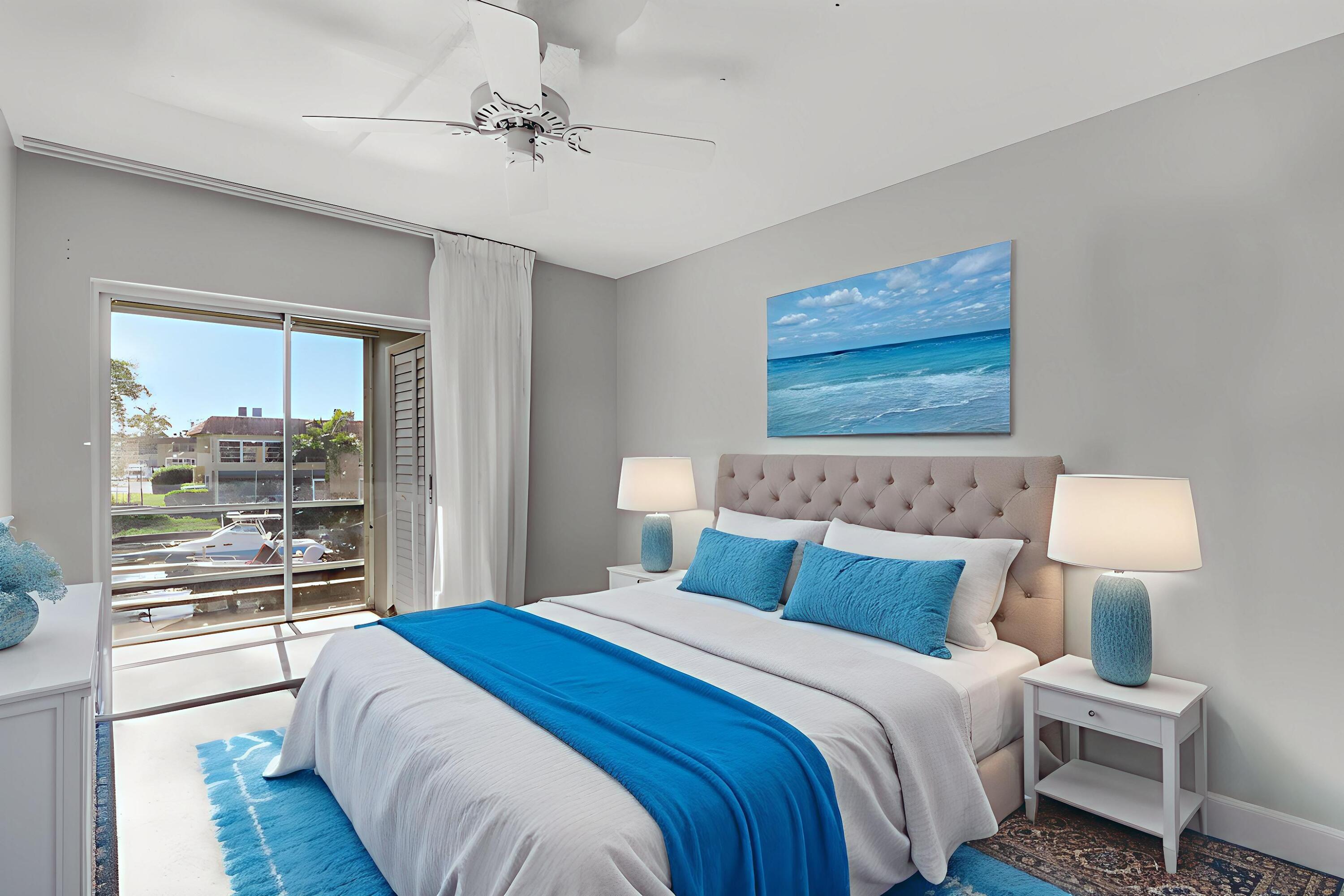 2600 South Kanner Highway, Unit Q8 Stuart, FL 34994 - Photo 22 of 52 a bedroom with a large bed and a night stand