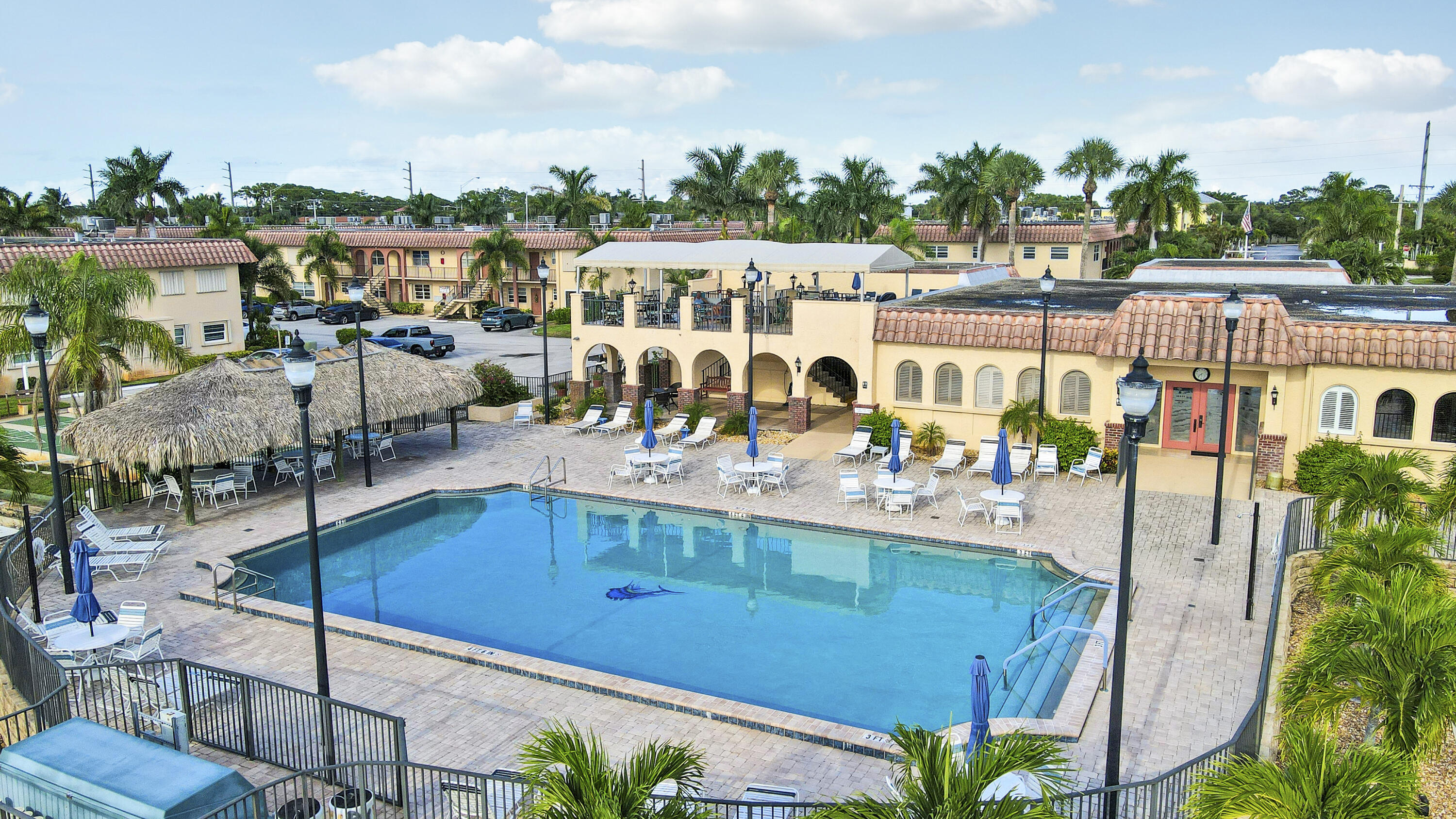 2600 South Kanner Highway, Unit Q8 Stuart, FL 34994 - Photo 33 of 52 a view of a swimming pool with outdoor seating