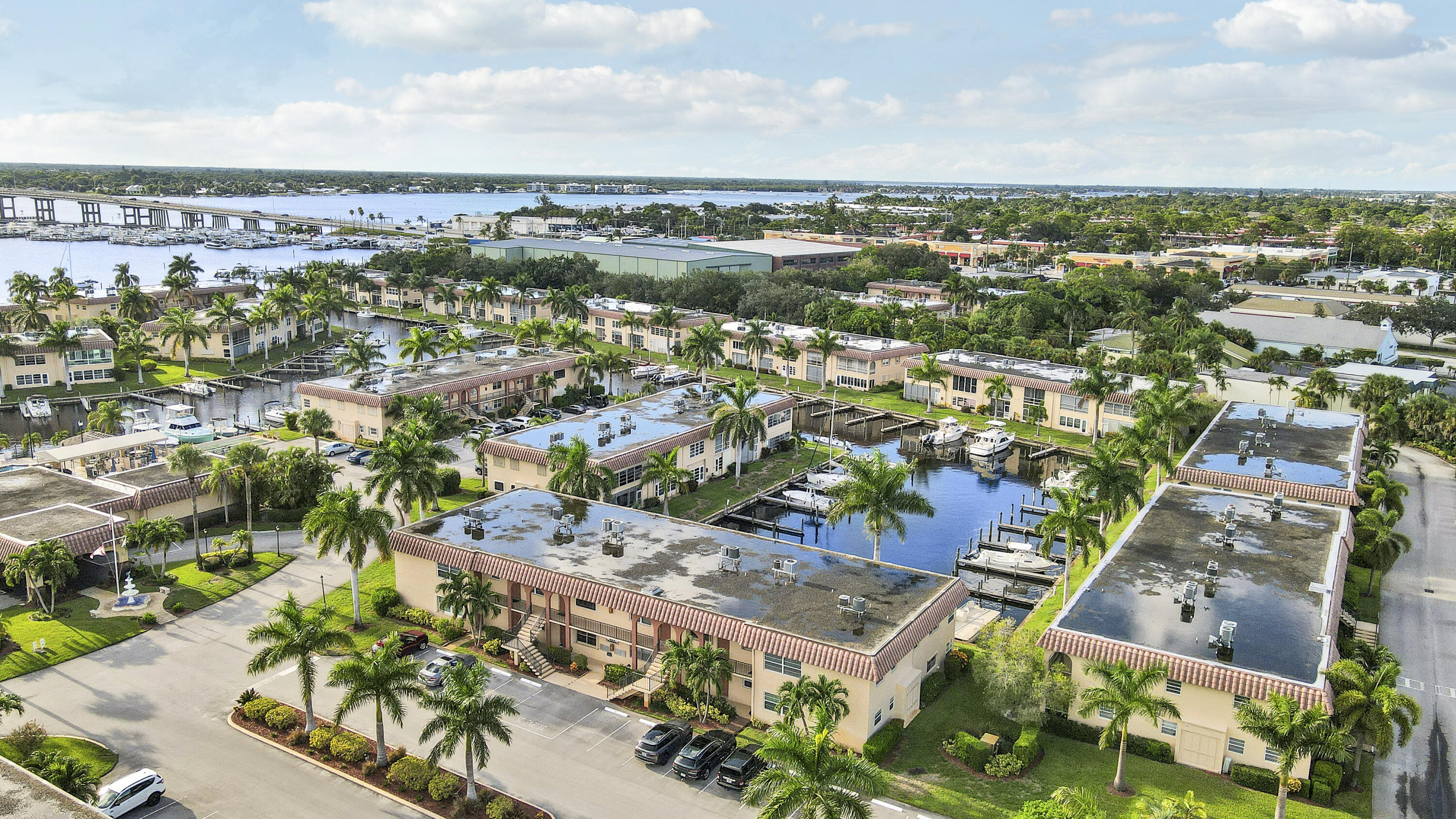 2600 South Kanner Highway, Unit Q8 Stuart, FL 34994 - Photo 36 of 52 an aerial view of residential building and lake view