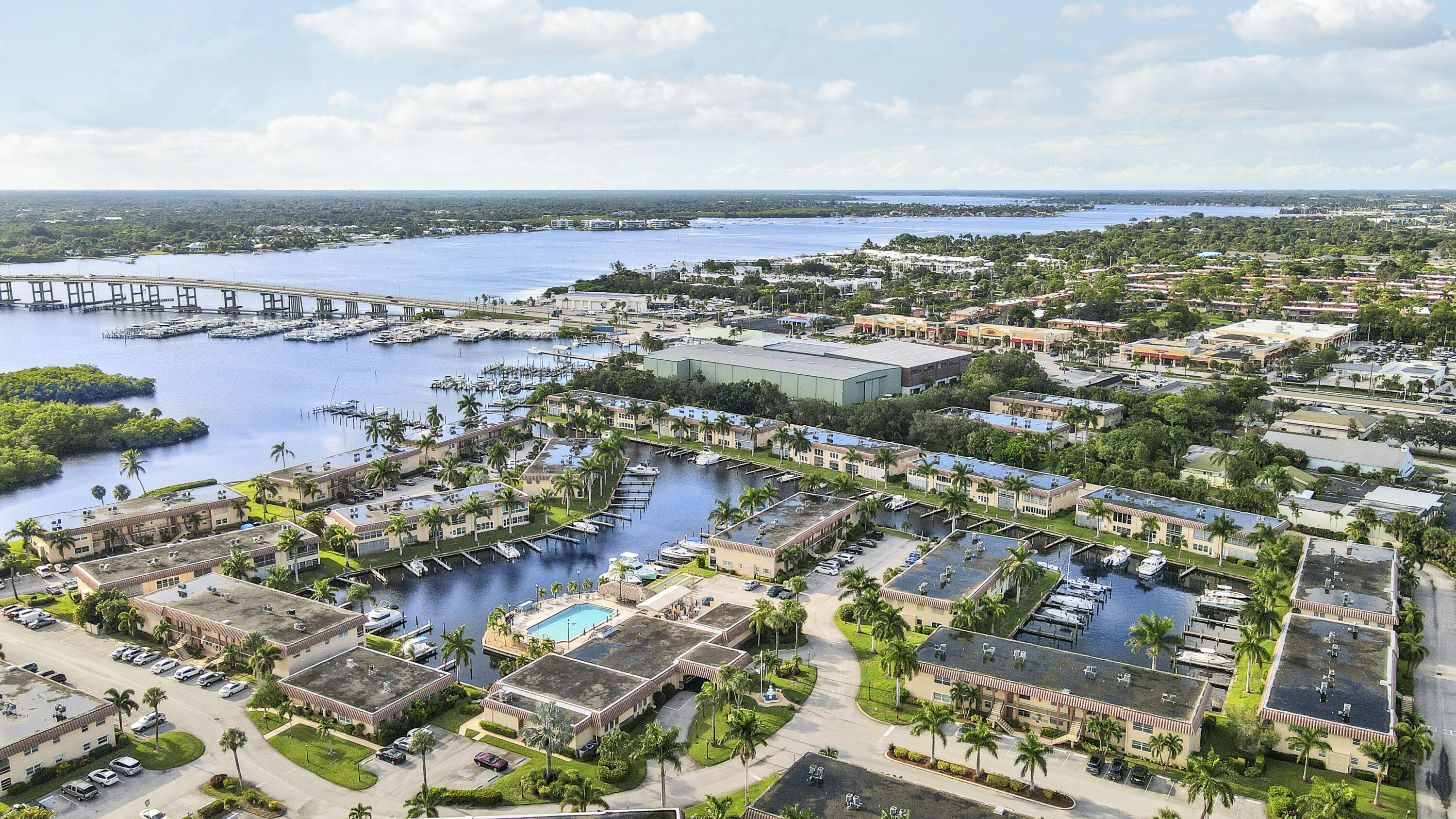 2600 South Kanner Highway, Unit Q8 Stuart, FL 34994 - Photo 38 of 52 an aerial view of lake and residential houses with outdoor space