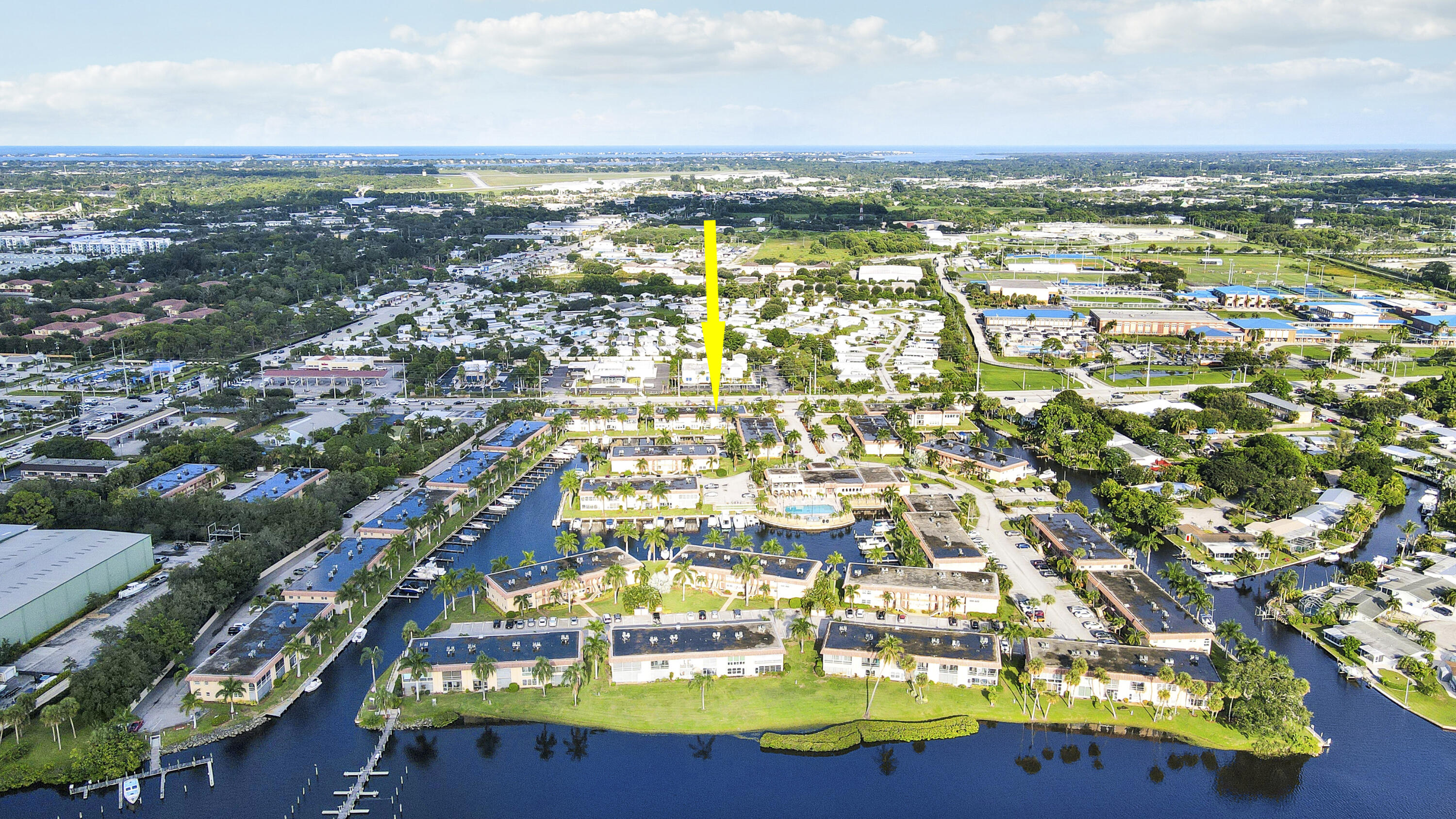 2600 South Kanner Highway, Unit Q8 Stuart, FL 34994 - Photo 41 of 52 an aerial view of residential houses with outdoor space and trees