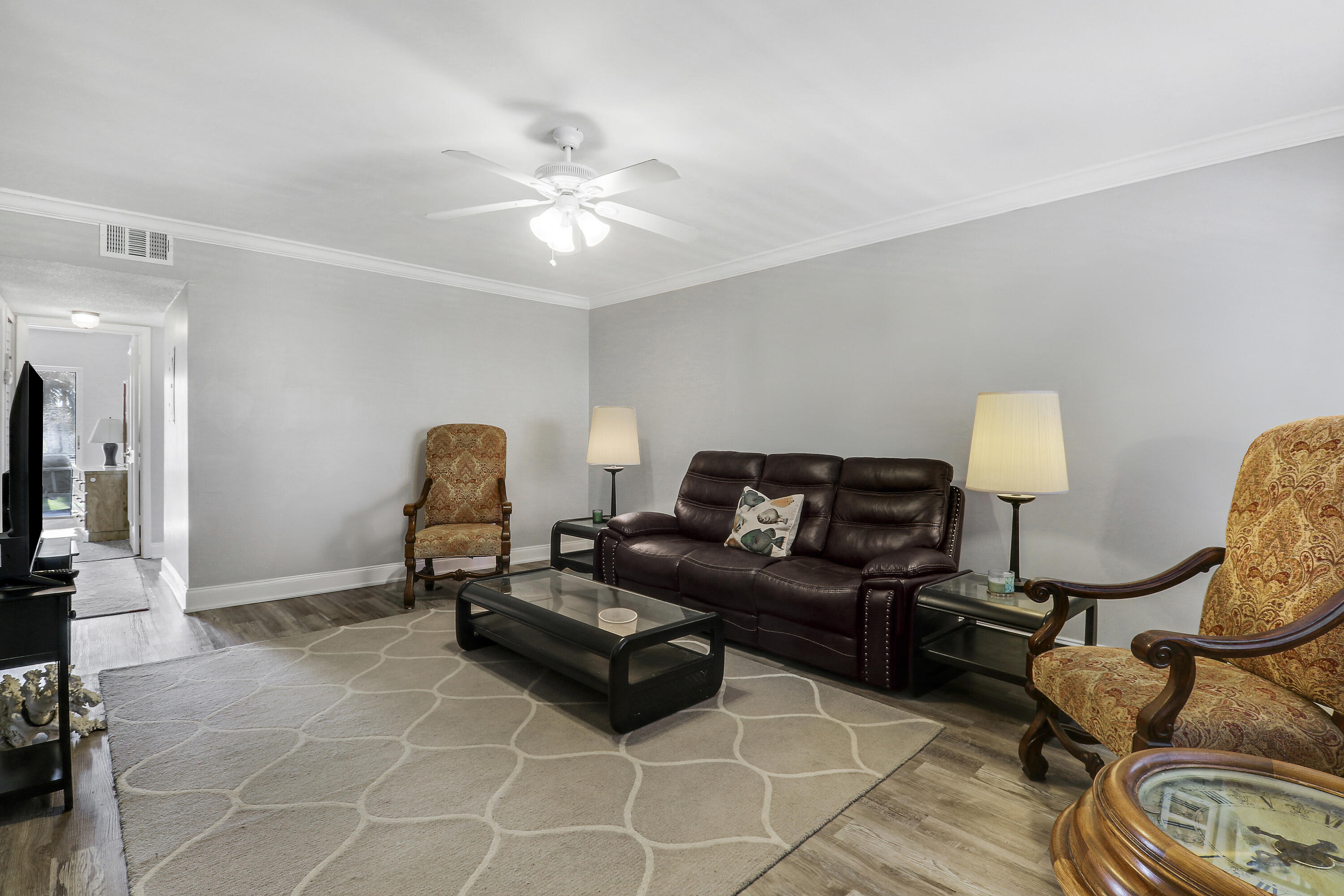 2600 South Kanner Highway, Unit Q8 Stuart, FL 34994 - Photo 6 of 52 a living room with furniture and a flat screen tv