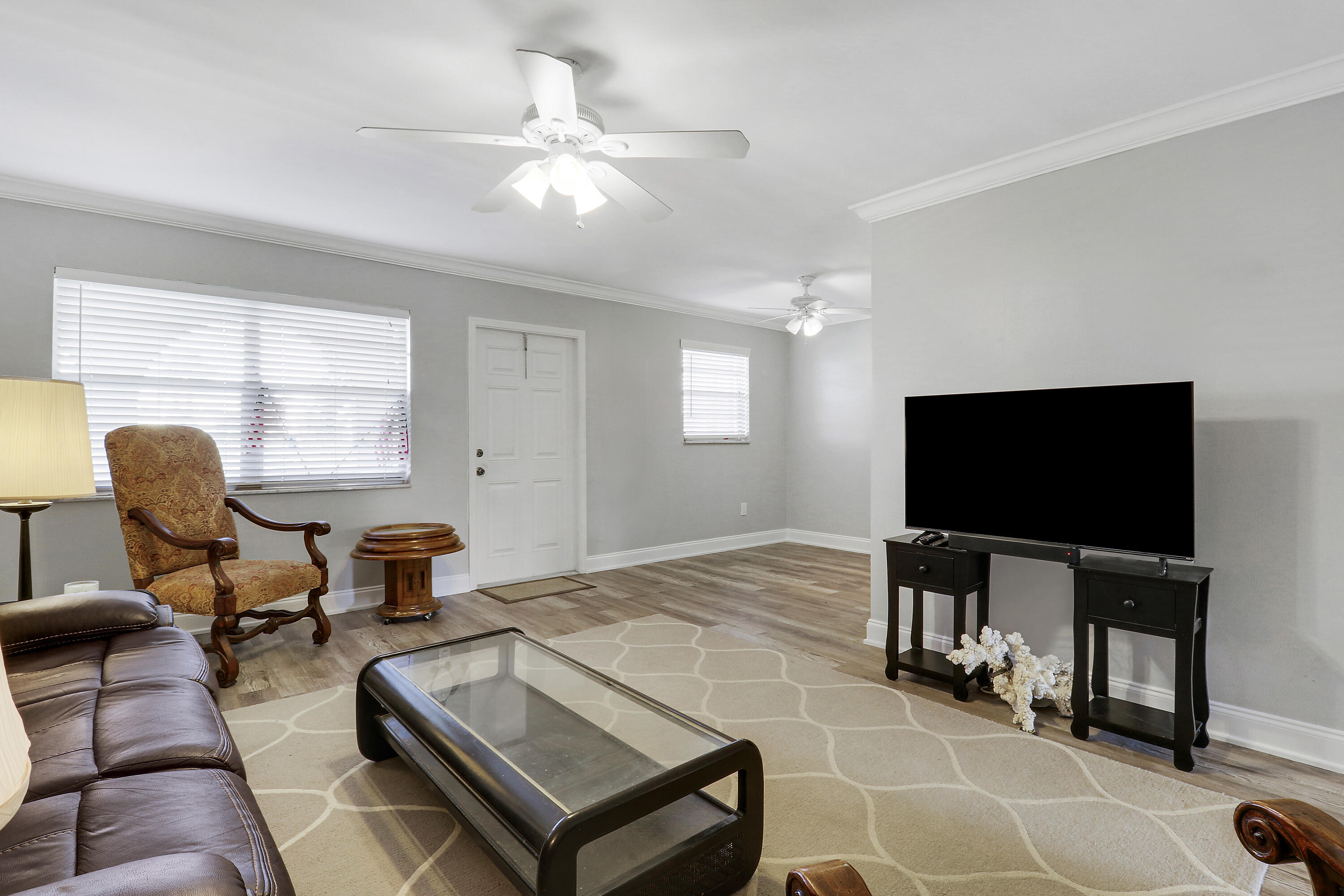 2600 South Kanner Highway, Unit Q8 Stuart, FL 34994 - Photo 8 of 52 a living room with furniture and a flat screen tv