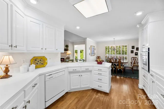 a kitchen with a cabinets and wooden floor