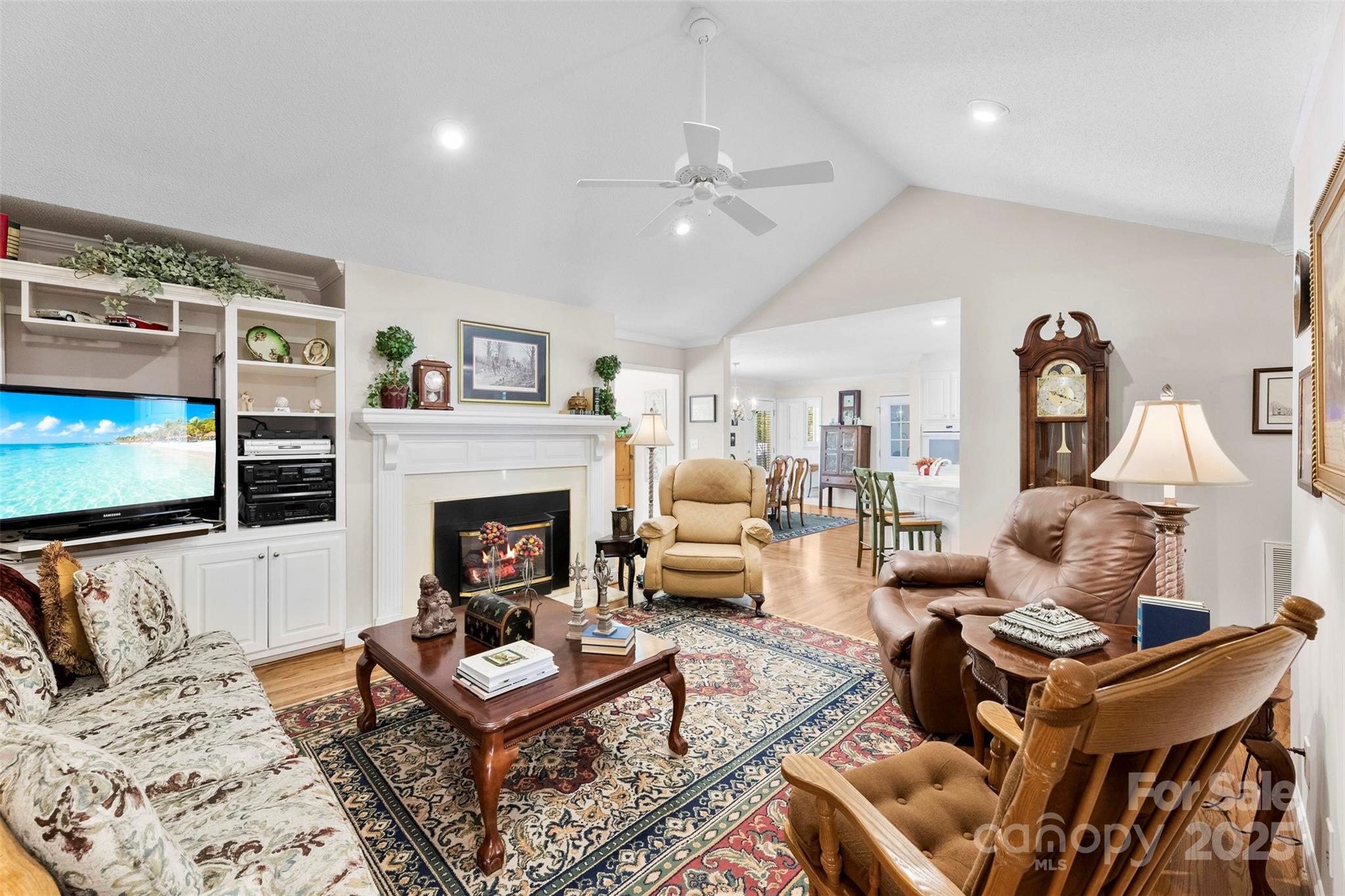 600 Queens Road Cherryville, NC 28021 - Photo 20 of 45 a living room with furniture a flat screen tv and a fireplace