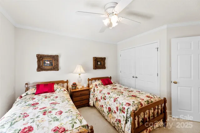 a bedroom with a bed and a dresser in it