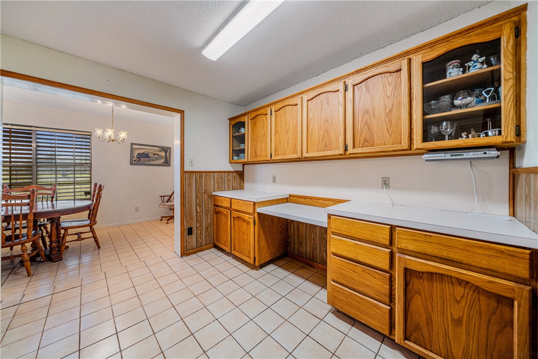 5469 Sunset Trail Robstown, TX 78380 - Photo 11 of 37 a kitchen that has a sink and chair