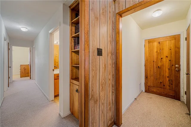 a view of a hallway with rooms