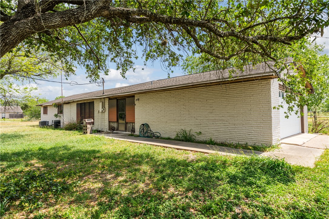 5469 Sunset Trail Robstown, TX 78380 - Photo 30 of 37 a front view of a house with a yard