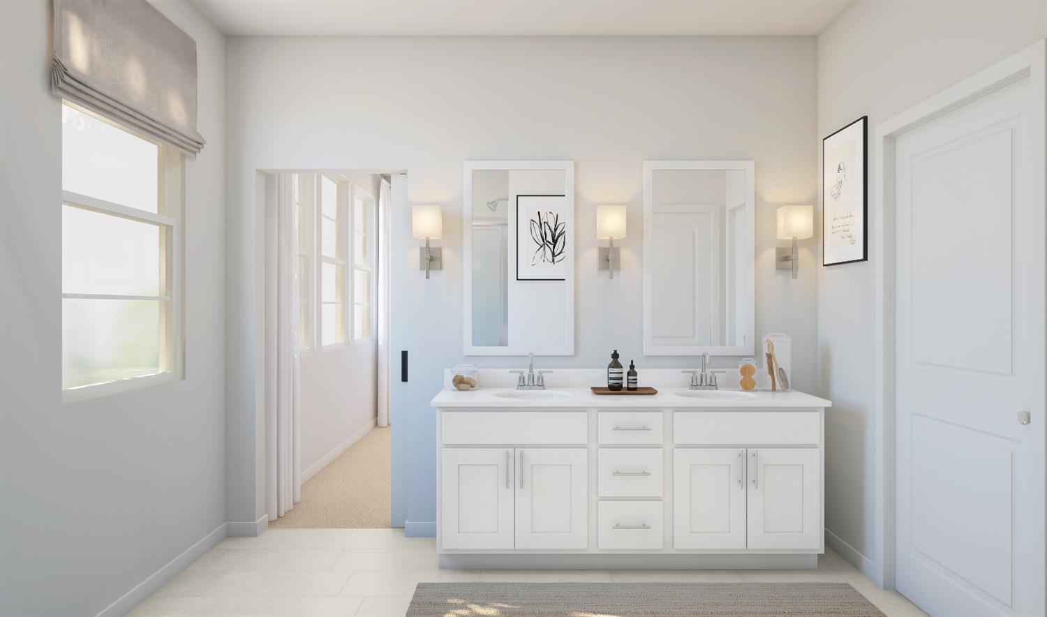 12250 Greenfinch Way Rancho Cordova, CA 95742 - Photo 15 of 17 a bathroom with a double vanity sink a mirror and a bathtub