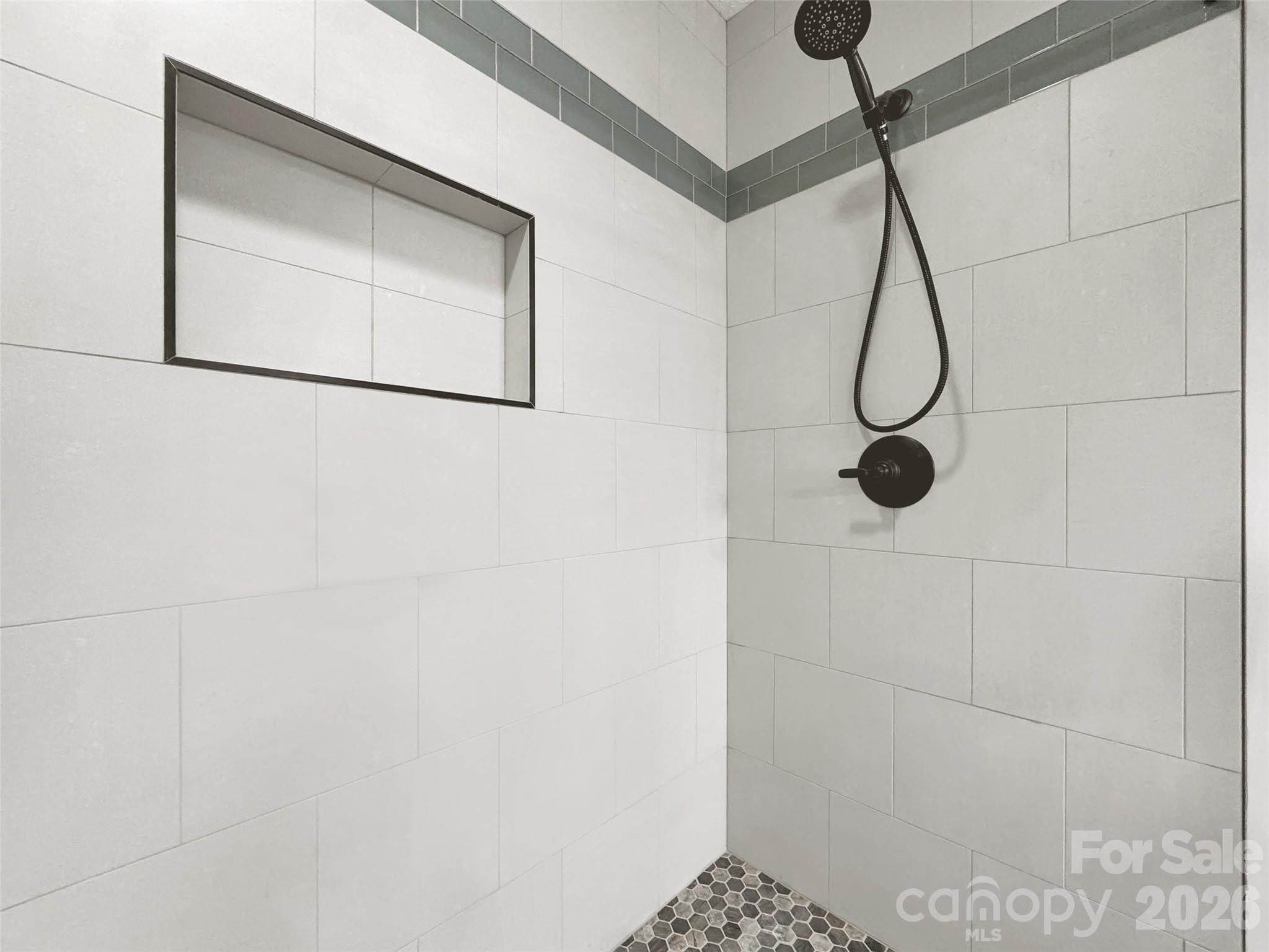 371 Falcon Ridge Drive Waynesville, NC 28786 - Photo 17 of 48 a bathroom with a shower and a mirror