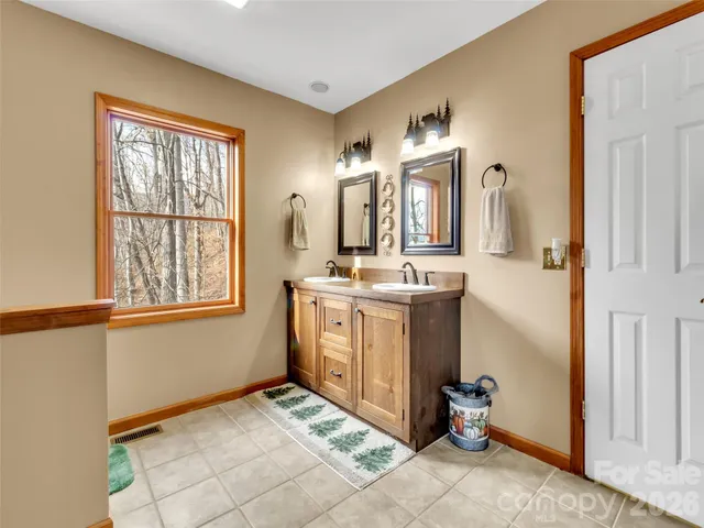 a bathroom with a shower and a mirror