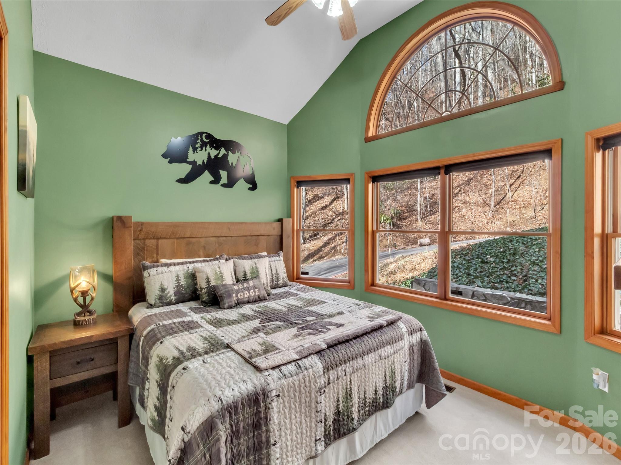 371 Falcon Ridge Drive Waynesville, NC 28786 - Photo 24 of 48 a bedroom with a large bed and a window