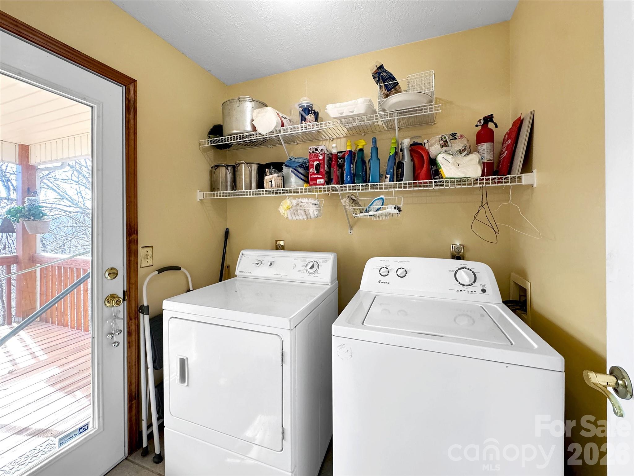 371 Falcon Ridge Drive Waynesville, NC 28786 - Photo 31 of 48 a utility room with dryer and washer
