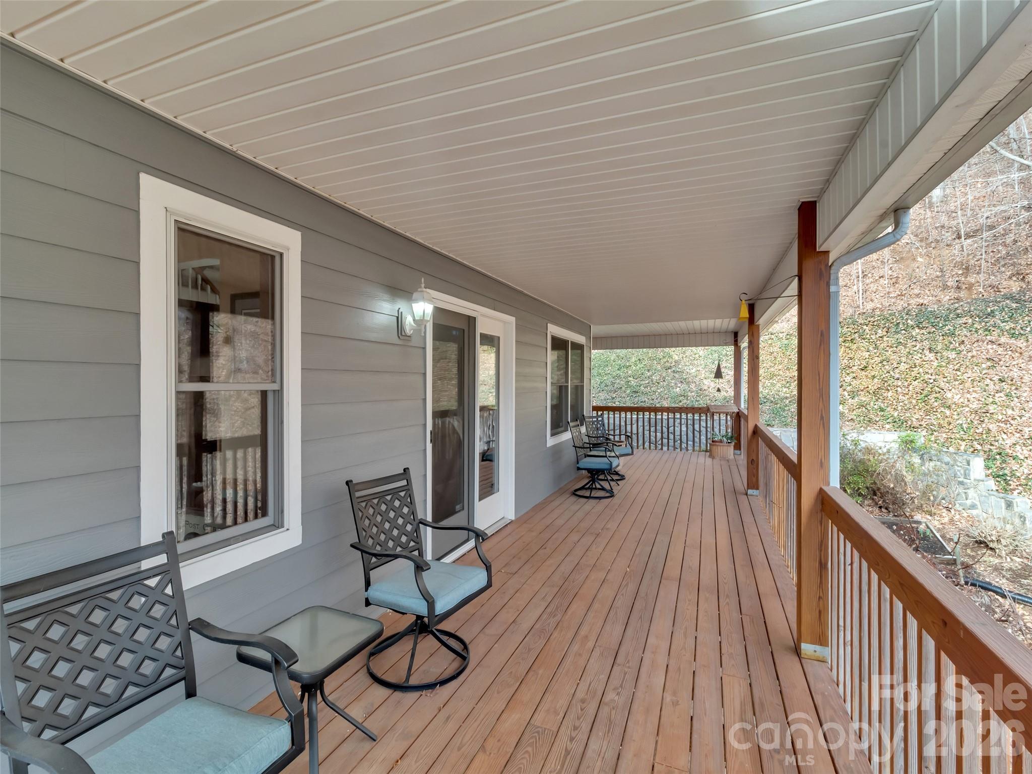 371 Falcon Ridge Drive Waynesville, NC 28786 - Photo 36 of 48 a balcony with furniture and wooden floor