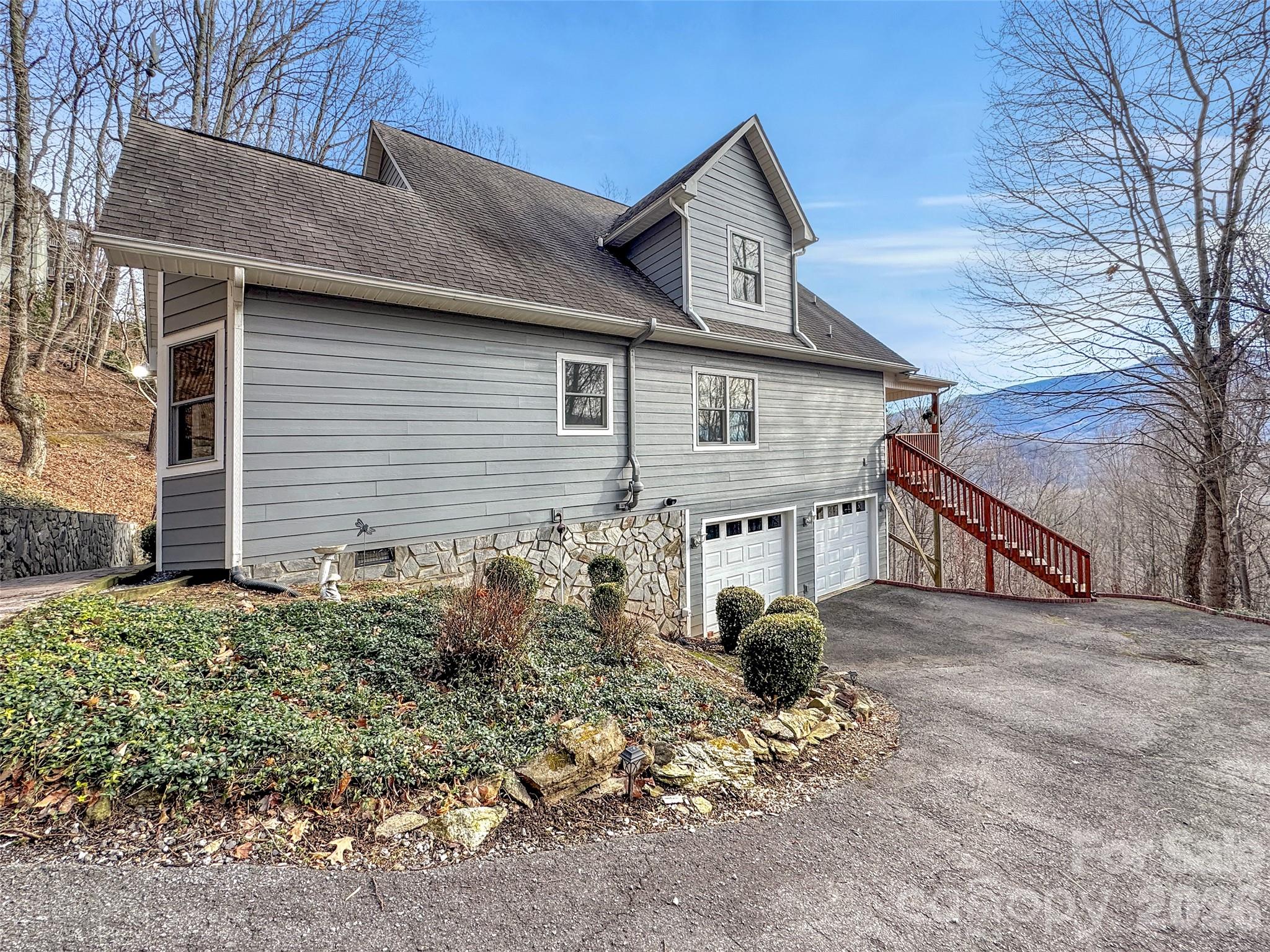 371 Falcon Ridge Drive Waynesville, NC 28786 - Photo 41 of 48 a view of a house with backyard and trees