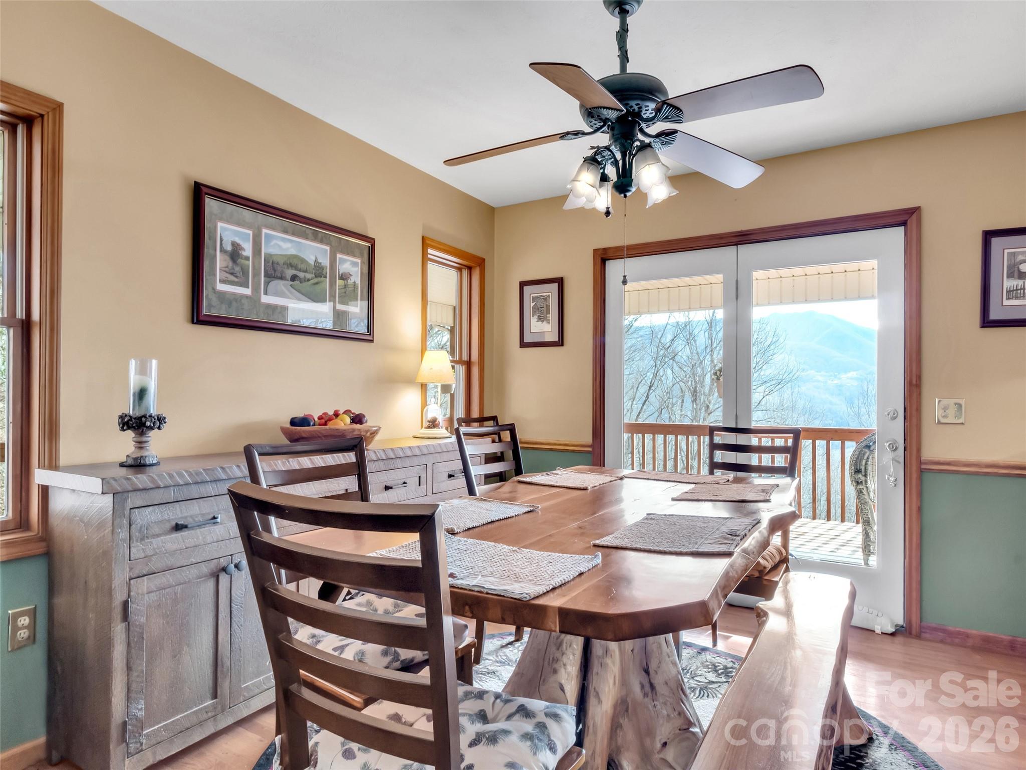 371 Falcon Ridge Drive Waynesville, NC 28786 - Photo 7 of 48 a view of a dining room with furniture window and wooden floor
