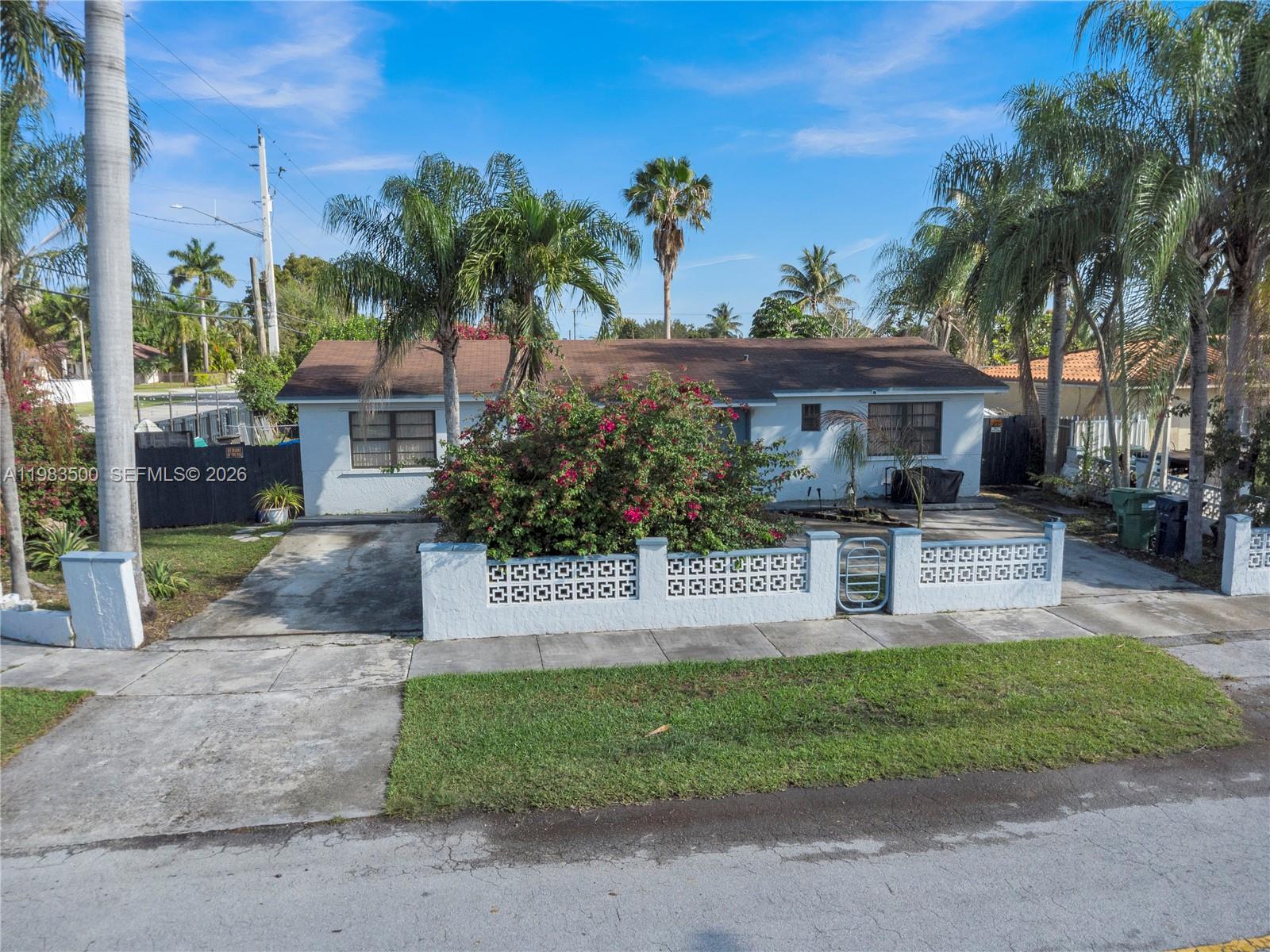 12691 Southwest 190th Street Miami, FL 33177 - Photo 1 of 46 a view of a house with palm trees