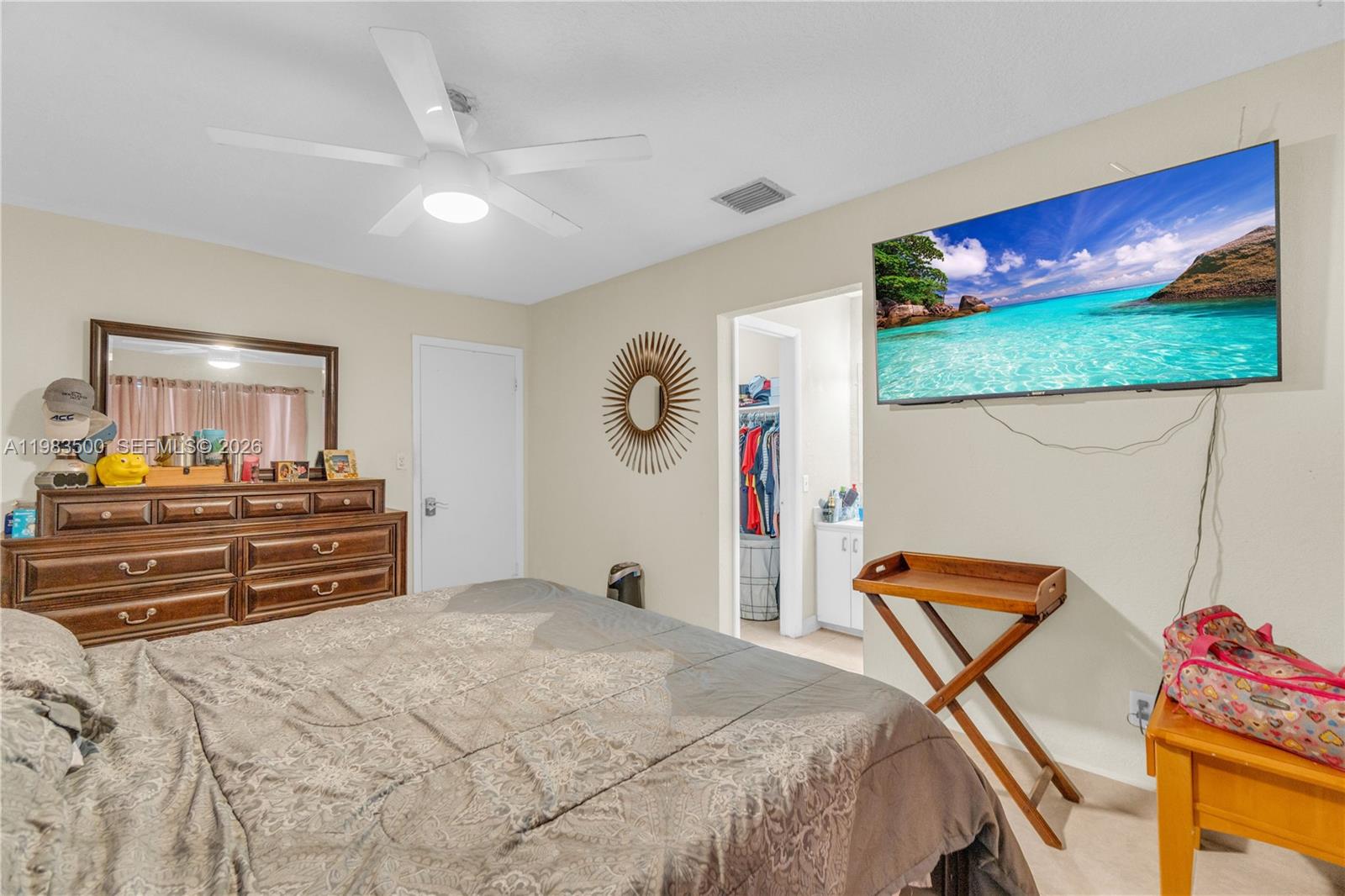 12691 Southwest 190th Street Miami, FL 33177 - Photo 11 of 46 a bed room with a bed and a dresser