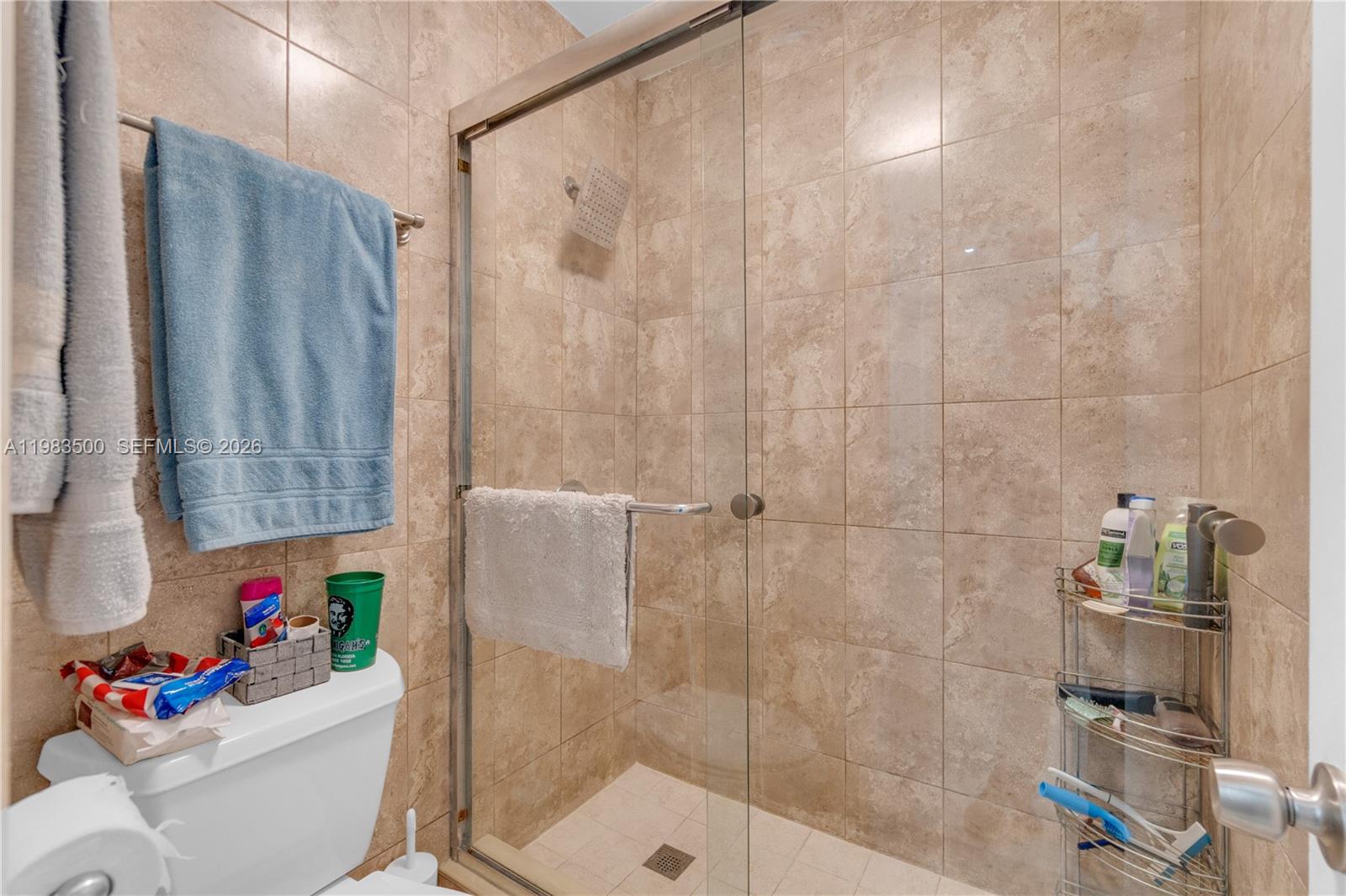 12691 Southwest 190th Street Miami, FL 33177 - Photo 13 of 46 a white bath tub sitting next to a white toilet and sink