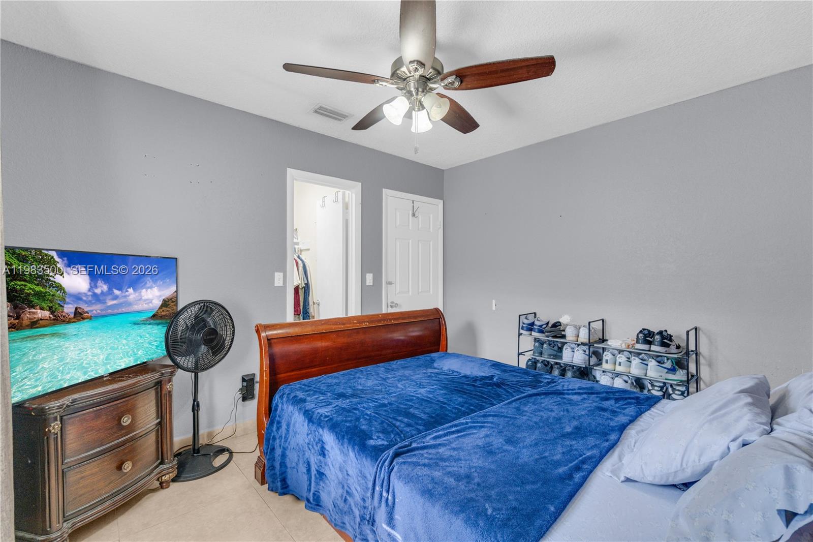 12691 Southwest 190th Street Miami, FL 33177 - Photo 20 of 46 a bedroom with a bed and a window