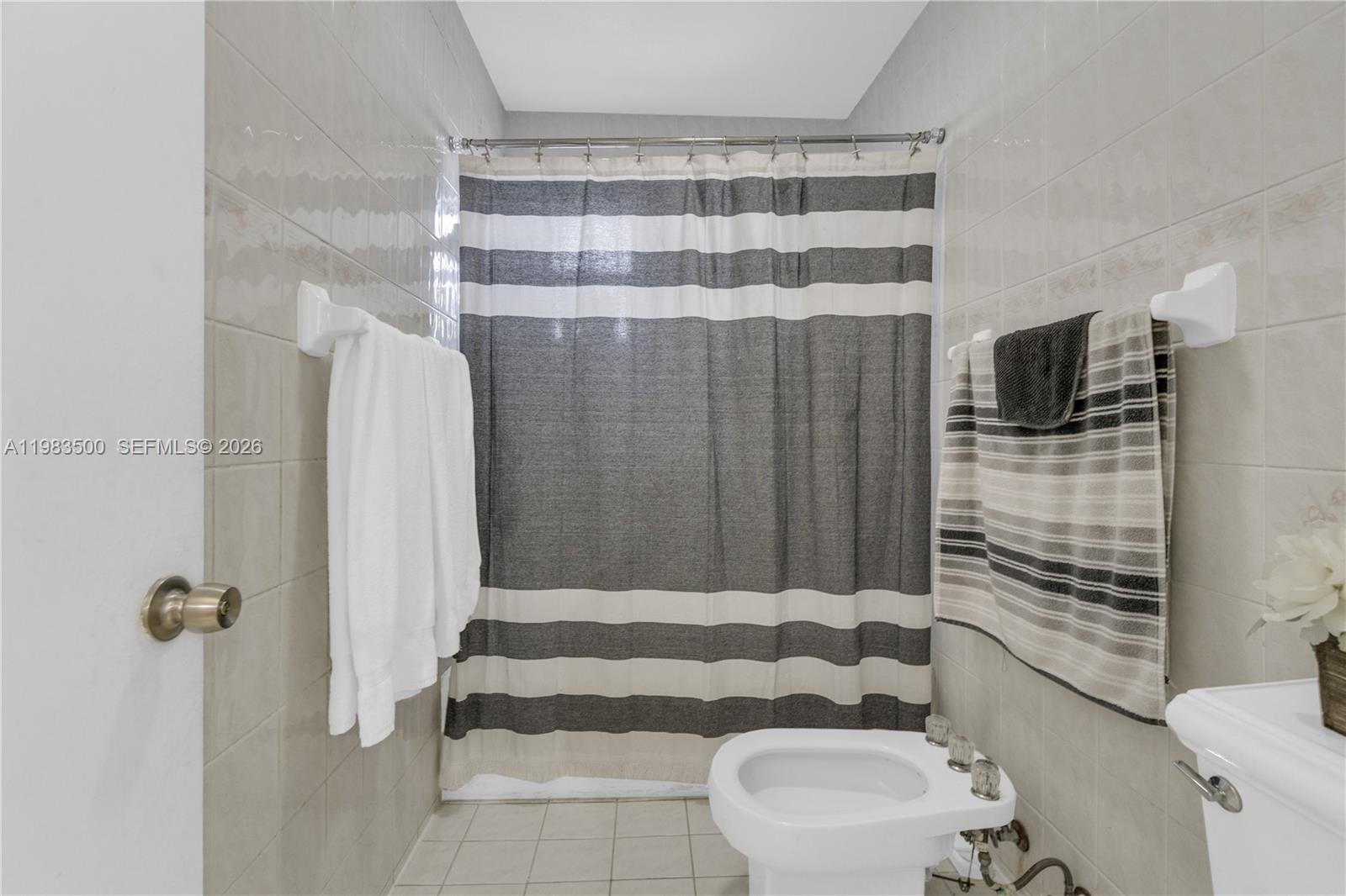 12691 Southwest 190th Street Miami, FL 33177 - Photo 22 of 46 a bathroom with a bathtub and shower