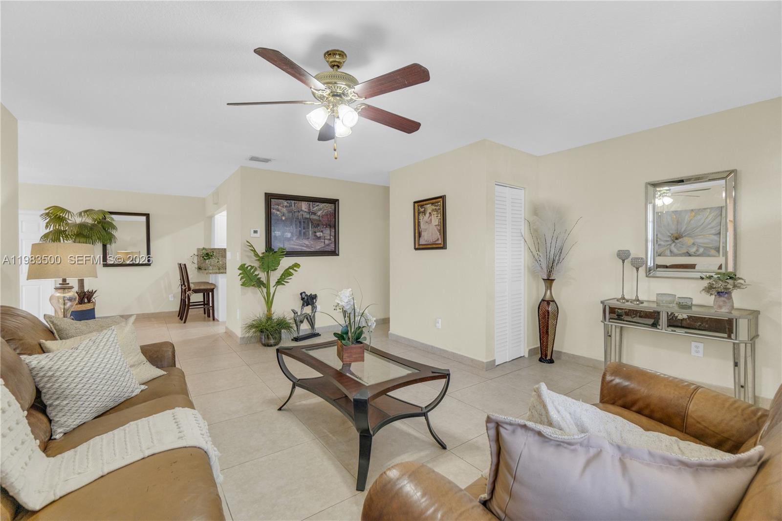 12691 Southwest 190th Street Miami, FL 33177 - Photo 26 of 46 a living room with furniture and a view of kitchen