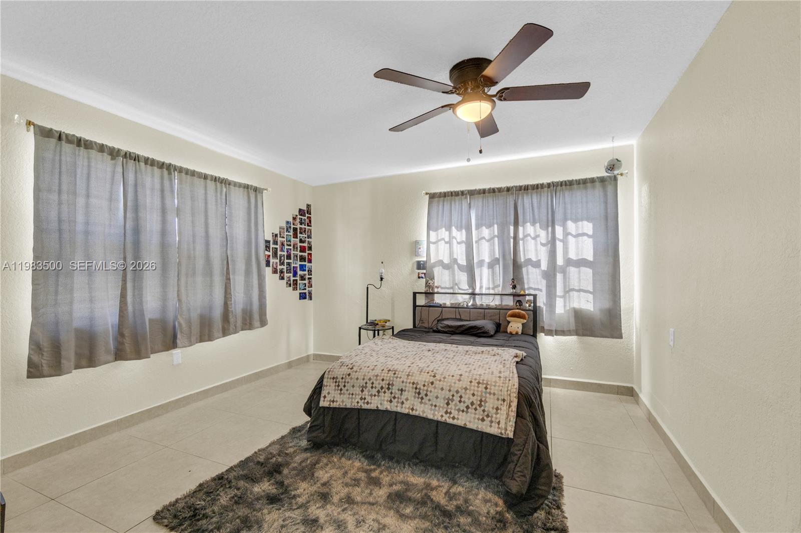12691 Southwest 190th Street Miami, FL 33177 - Photo 30 of 46 a living room with furniture and a large window