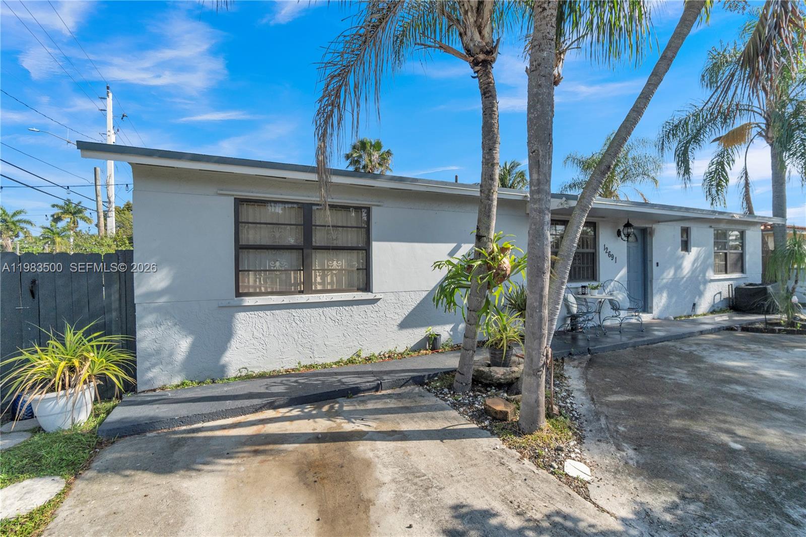 12691 Southwest 190th Street Miami, FL 33177 - Photo 3 of 46 a front view of a house with garden