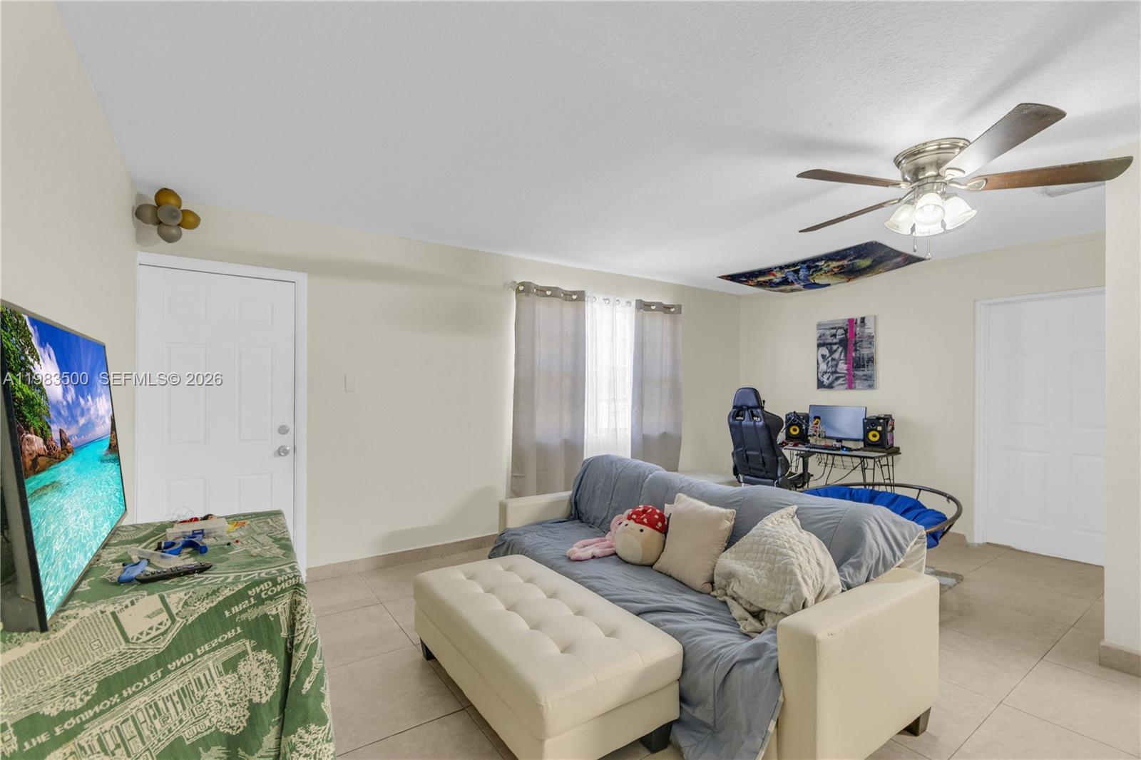 12691 Southwest 190th Street Miami, FL 33177 - Photo 31 of 46 a bedroom with furniture and a window