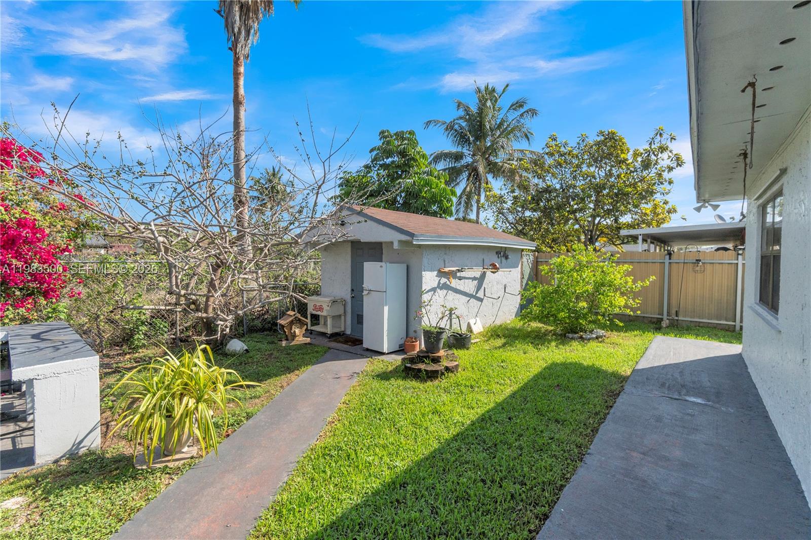 12691 Southwest 190th Street Miami, FL 33177 - Photo 36 of 46 a front view of a house with a yard and fountain