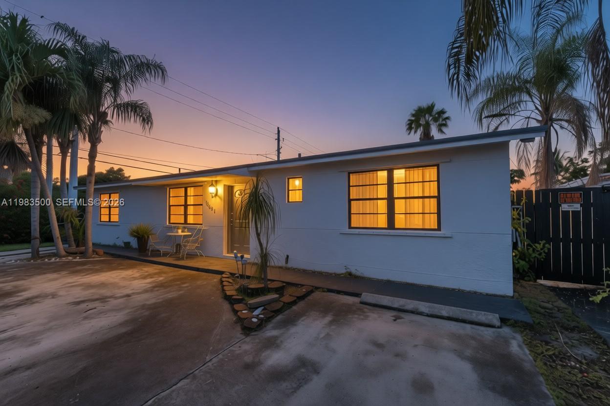 12691 Southwest 190th Street Miami, FL 33177 - Photo 40 of 46 a view of a house with a yard
