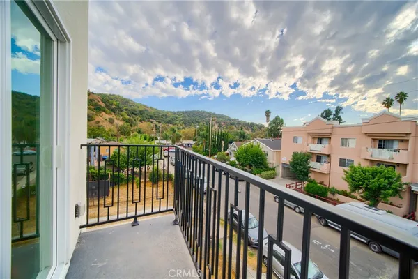 a kitchen with stainless steel appliances a refrigerator a stove top oven a sink and dishwasher