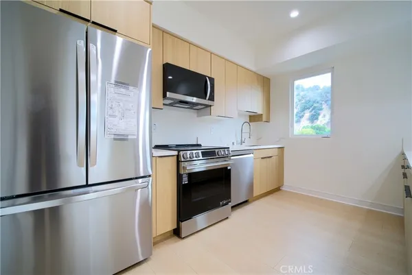 a kitchen with a stove and a sink