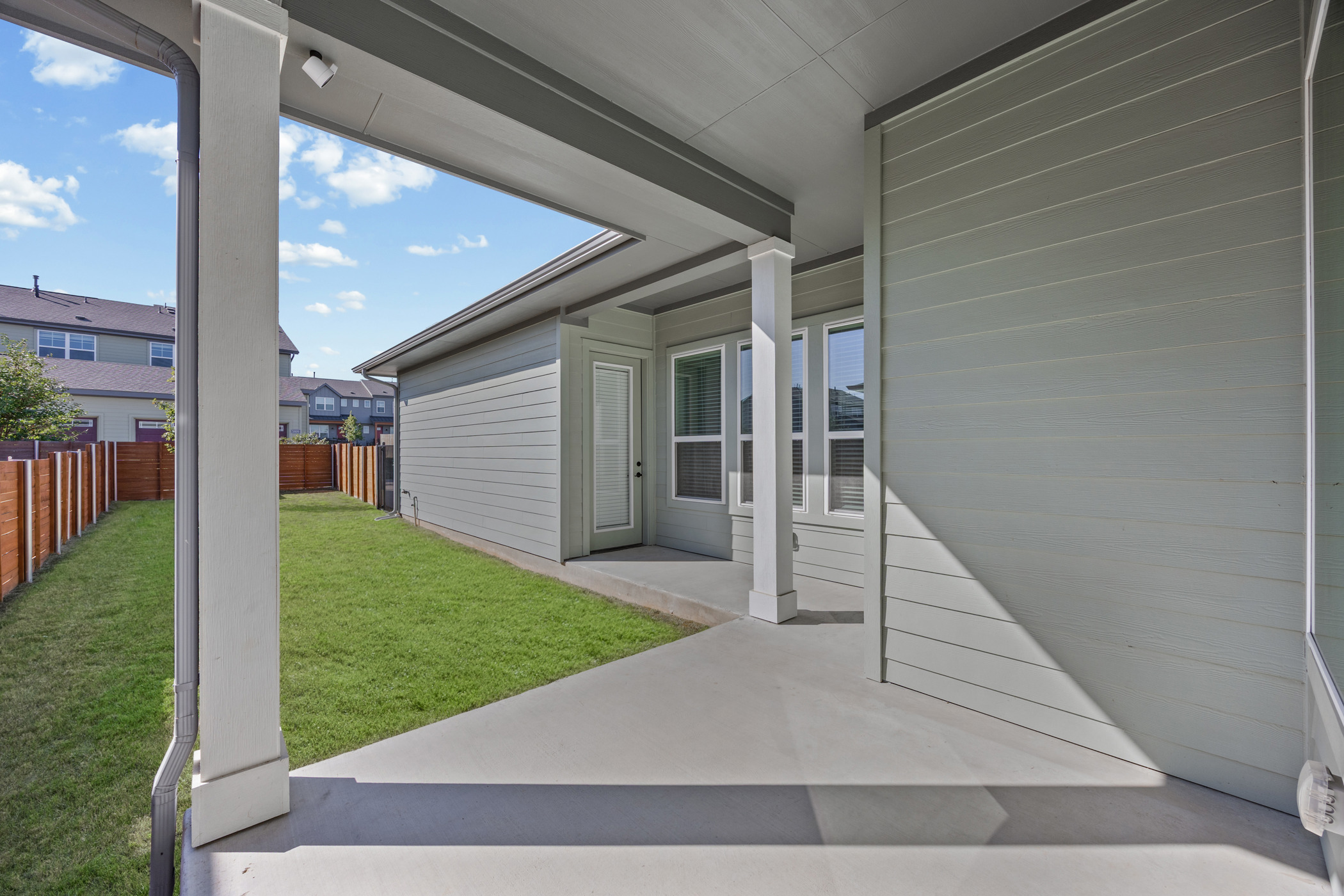 5806 Rangeland Road Austin, TX 78747 - Photo 28 of 34 A spacious covered patio provides a delightful outdoor living extension to this home.