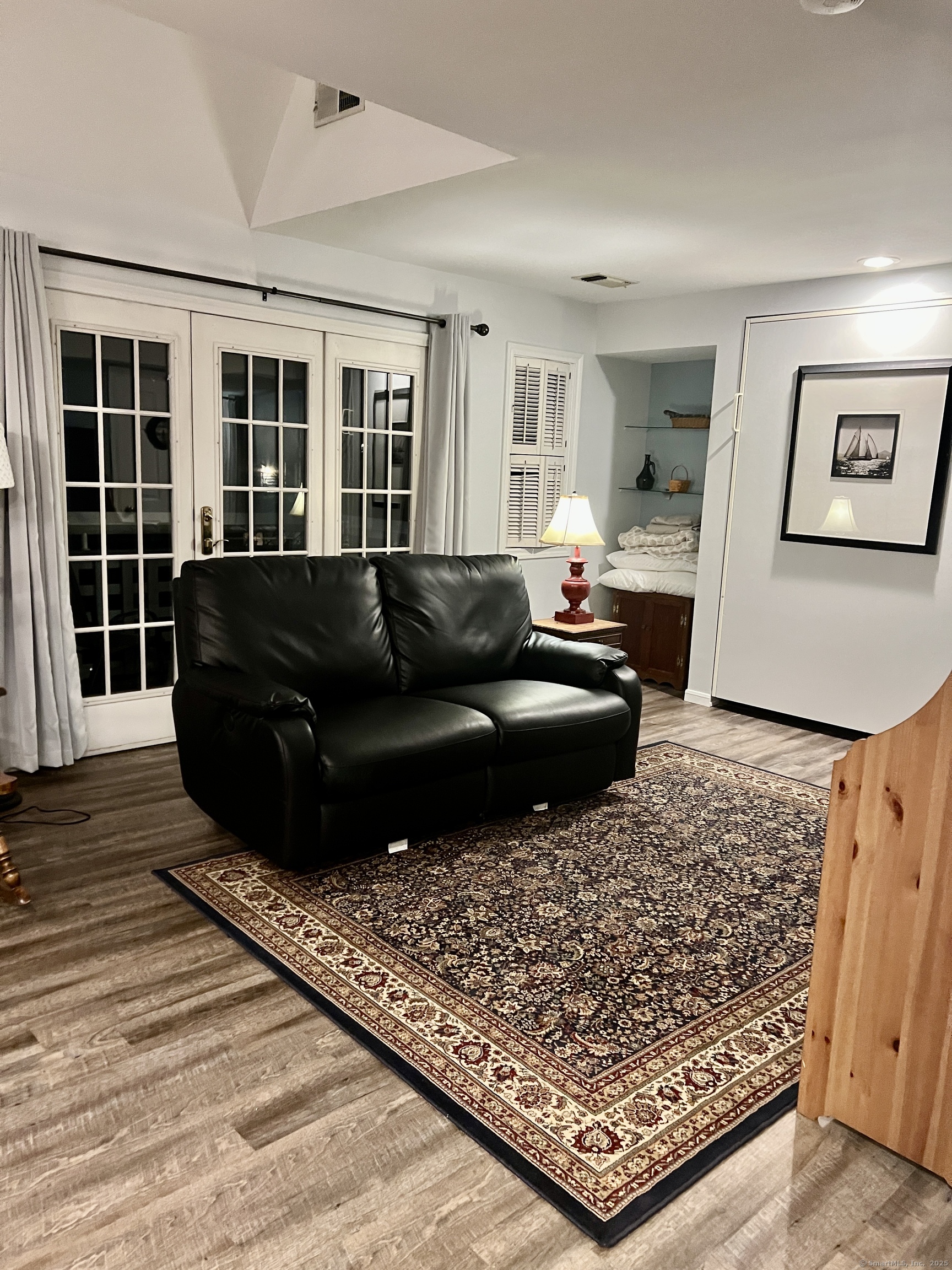 1623 Old Pond Lane, Unit 1623 Norwich, CT 06360 - Photo 10 of 40 a living room with furniture and a rug