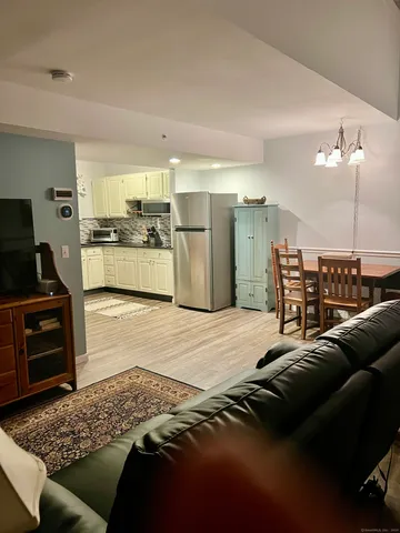 a living room with furniture and a rug