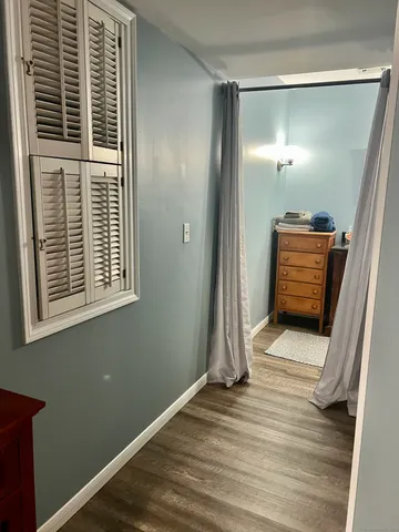 a bedroom with a bed and dresser