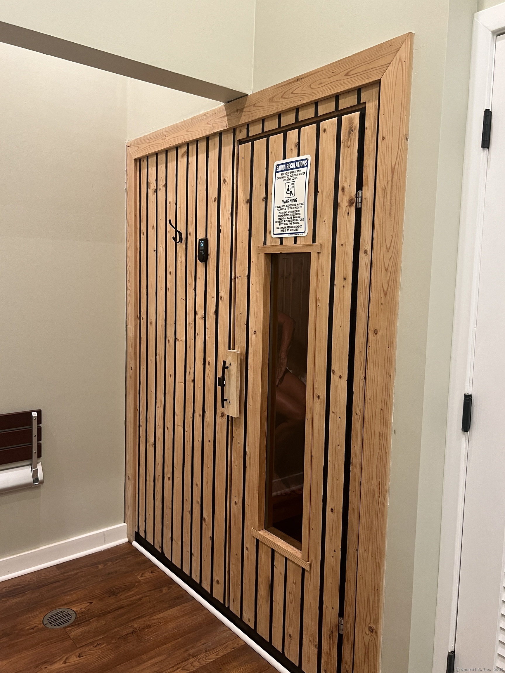 1623 Old Pond Lane, Unit 1623 Norwich, CT 06360 - Photo 29 of 40 a view of a hallway with wooden floor