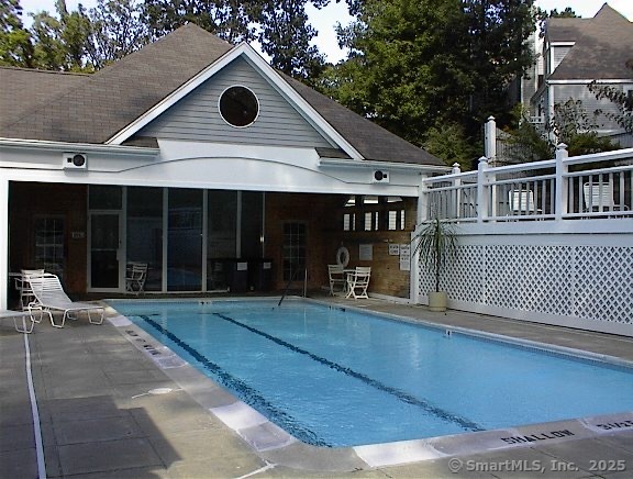 1623 Old Pond Lane, Unit 1623 Norwich, CT 06360 - Photo 30 of 40 a front view of a house with glass windows and yard