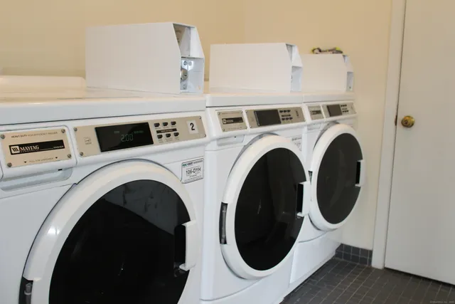 a view of a house that has a tree