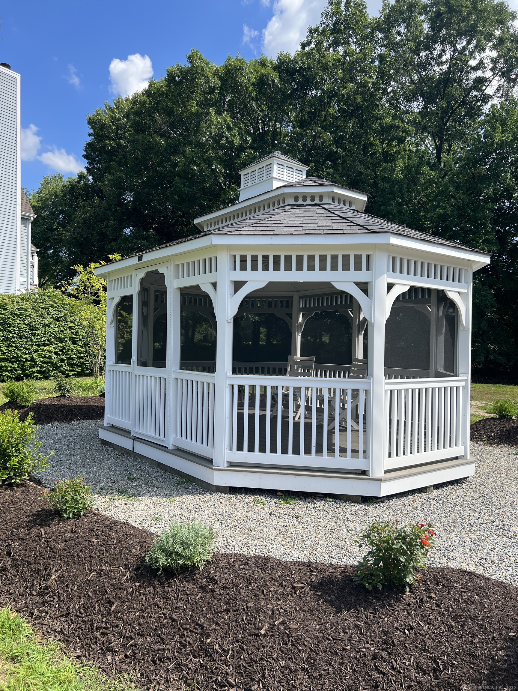 1623 Old Pond Lane, Unit 1623 Norwich, CT 06360 - Photo 37 of 40 a front view of a house with a garden