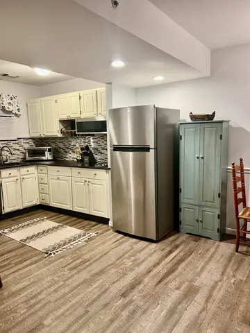 a kitchen with stainless steel appliances a refrigerator and a sink